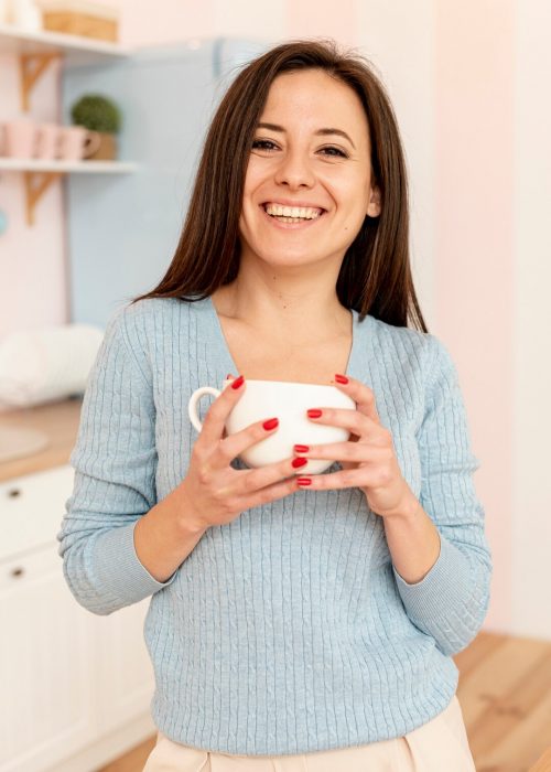 medium-shot-smiley-woman-posing-with-cup_23-2148334521 medium-shot-smiley-woman-posing-with-cup_23-2148334521